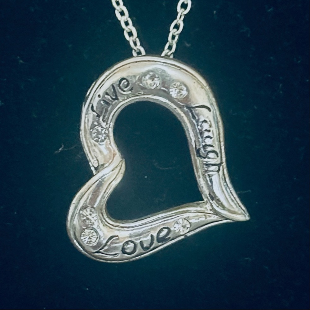 Elegant Silver Heart Pendant Necklace
Live 🌹Laugh 😃Love ♥️